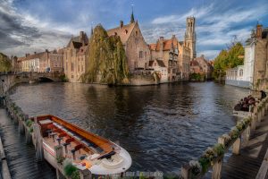 A wide angle shot a boats and the view of the "postcard perfect" Rozenhoedkaai in Bruges Belgium. Photo by Photo Tour Brugge.